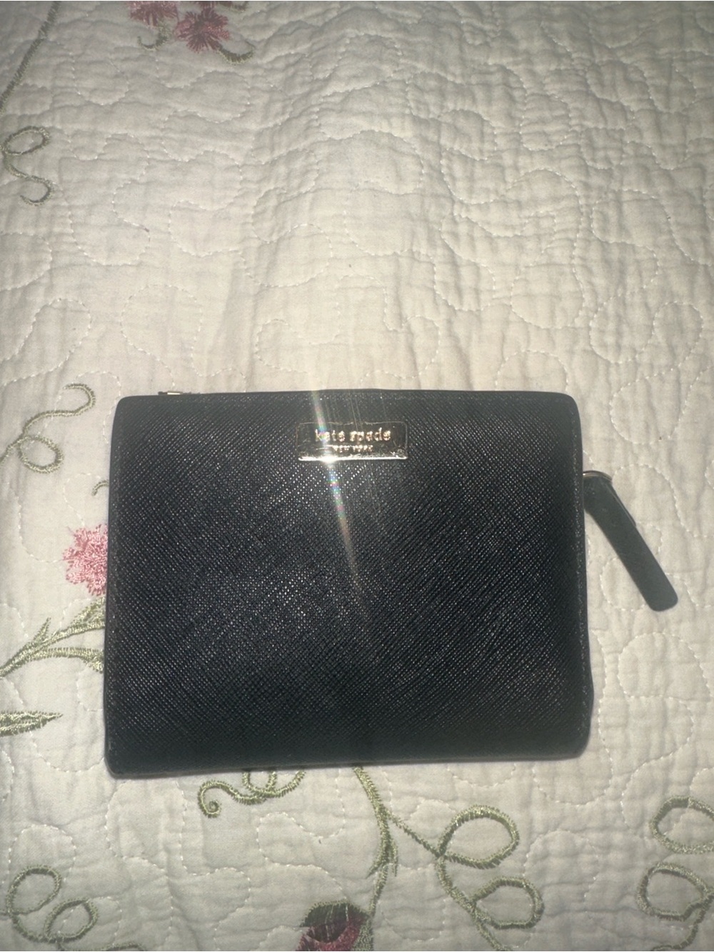 kate spade black saffiano zip-around wallet with gold plaque
